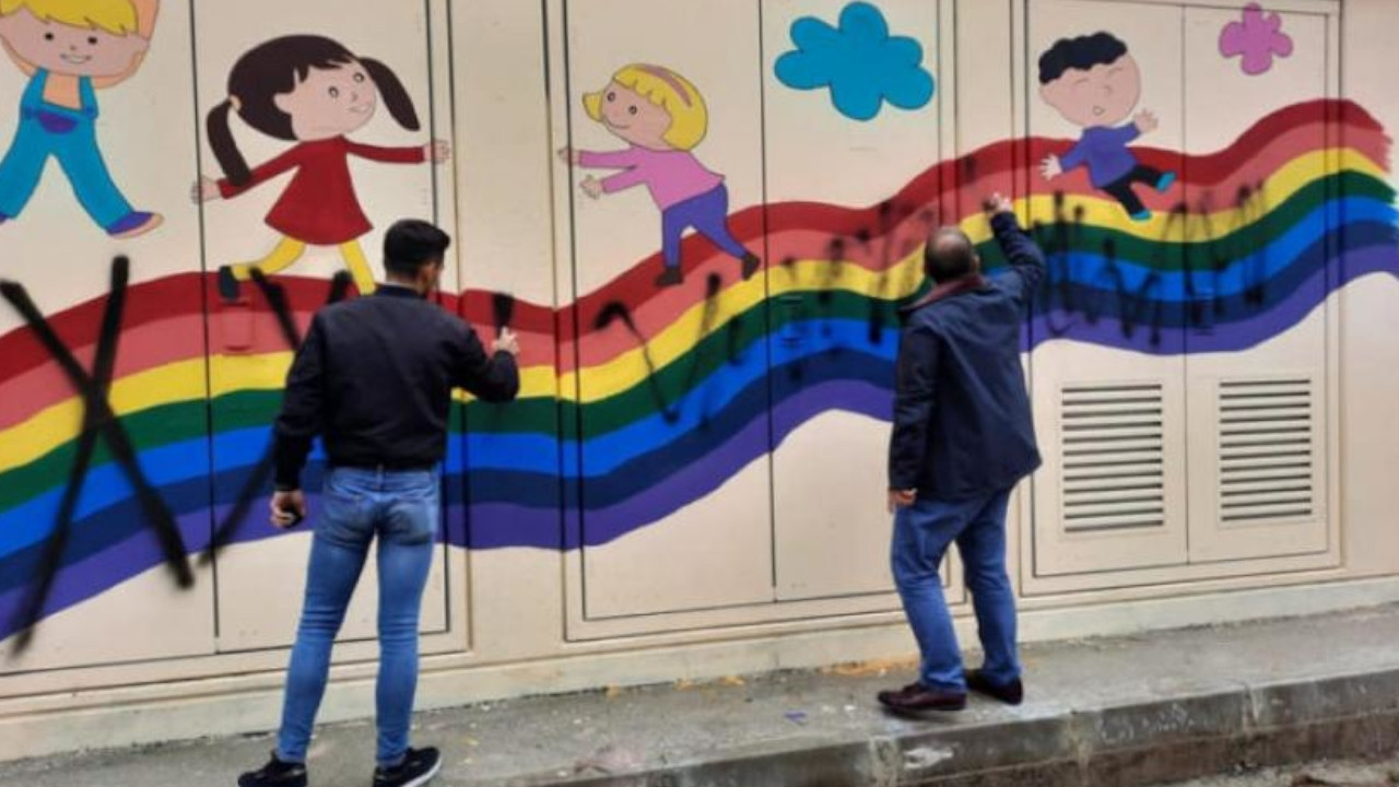 Members of Turkish fascist group Grey Wolves graffiti over rainbow mural