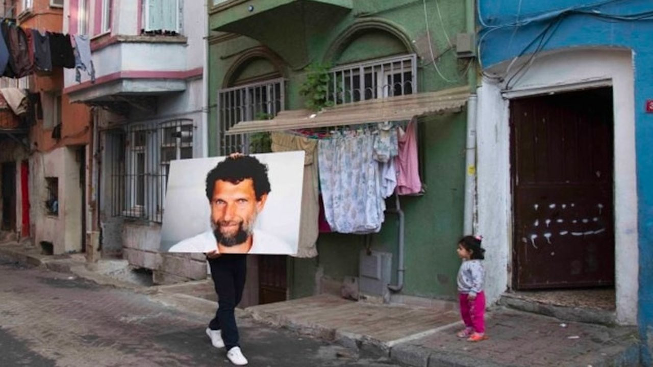 Artist parades Osman Kavala's picture in Istanbul streets