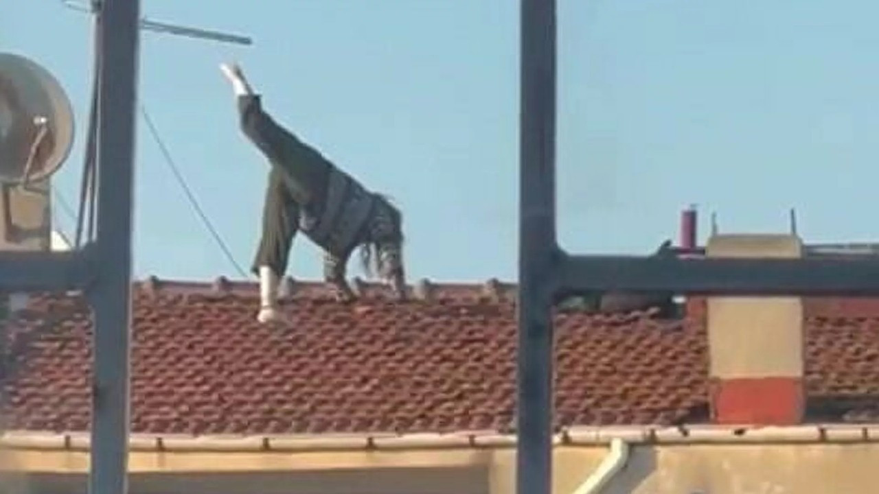 Woman recorded doing yoga on roof of multi-story building in Istanbul