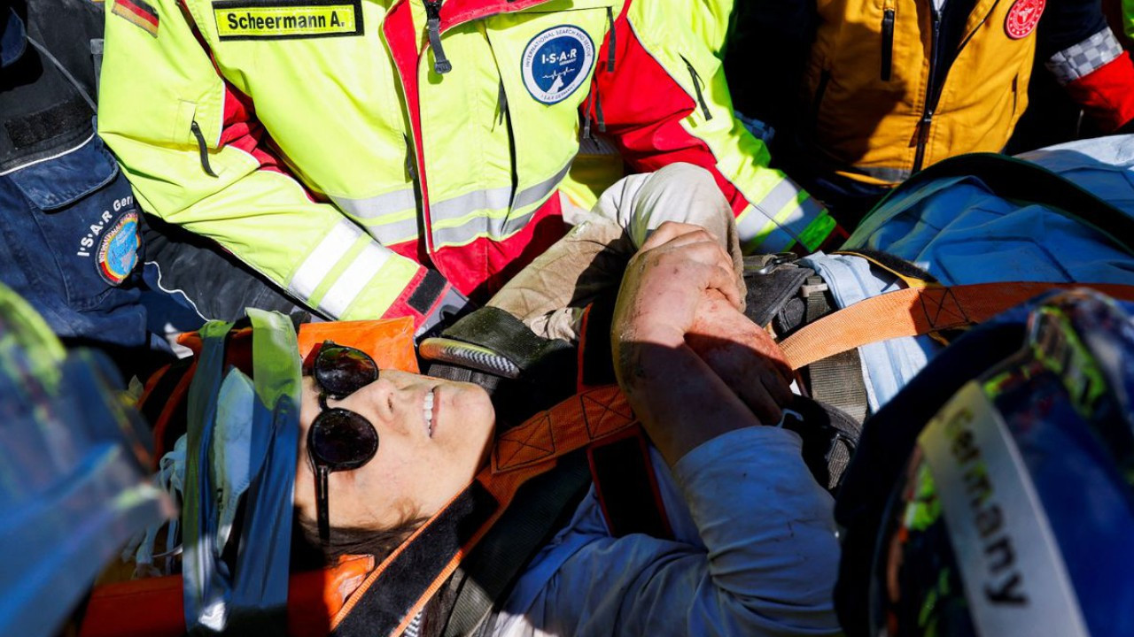 Woman pulled from earthquake rubble in southern Turkey after more than 100 hours