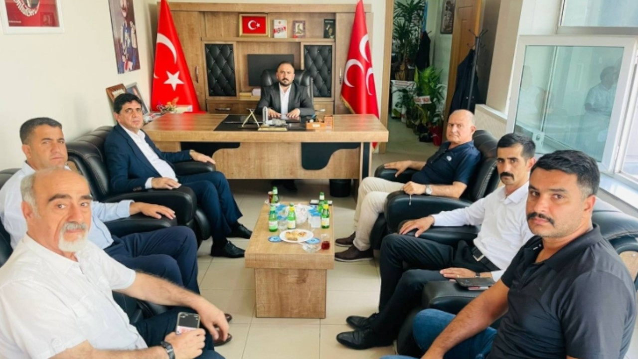 Turkish university rector visits MHP provincial head to congratulate him for new post