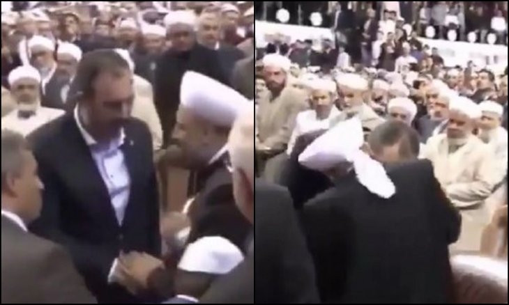 Newly surfaced footage shows Turkish minister kissing hands of religious cult leader, causes uproar