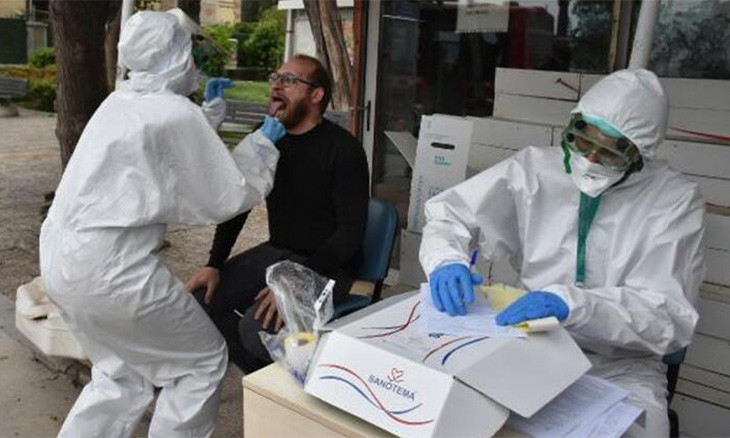 Two Izmir health workers conduct random COVID-19 tests on the street