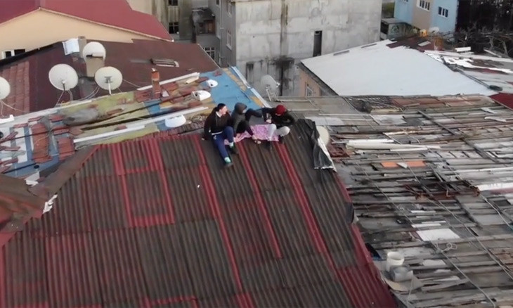 Istanbul police drone warns residents off building roof during COVID-19 curfew