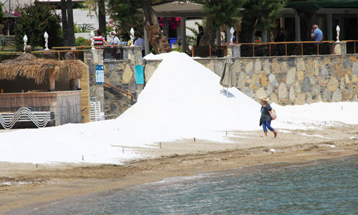 Hotel in resort town Bodrum covers beach with marble powder, claims it's 'white sand'