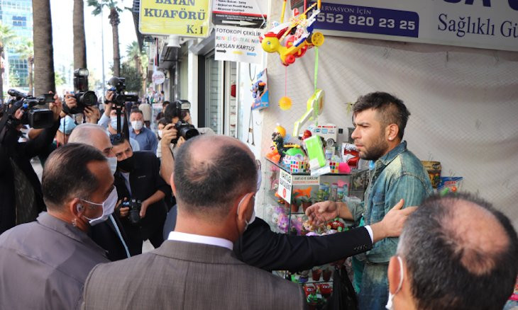 I want to die because of the economy, says Turkish shop owner when asked why he is not wearing a mask